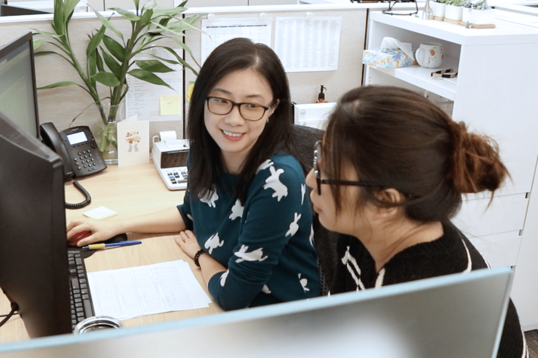 Two female Hajoca employees working together at a desk